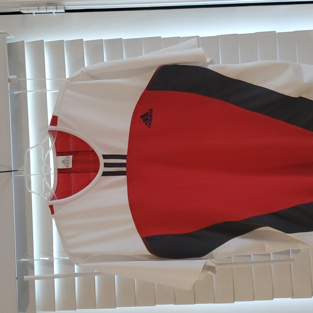 Adidas shirt size medium.